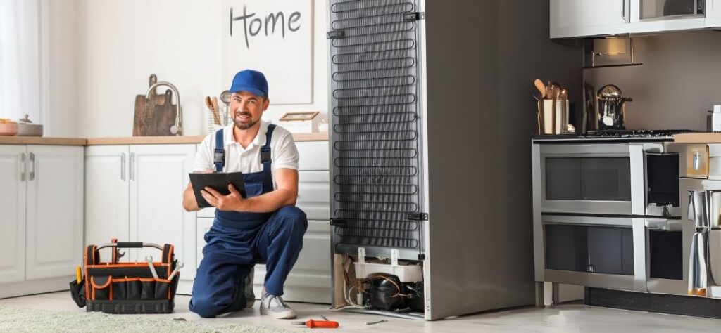 technician working on a washing machine or fridge