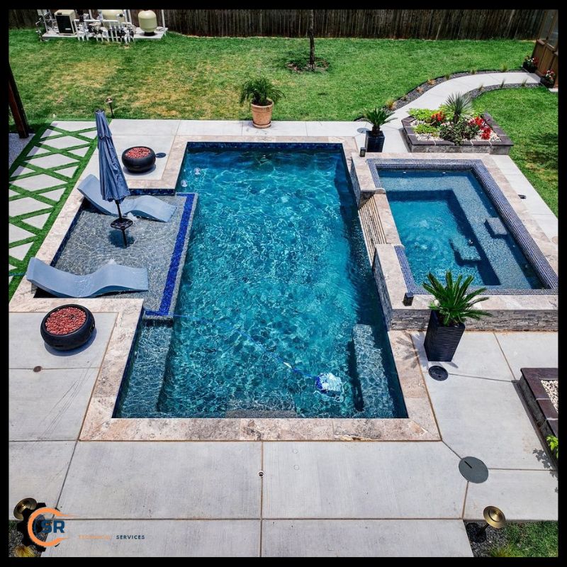 Technicians inspecting a worn pool surface before restoration